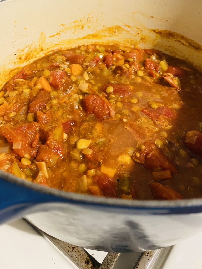 Lentil tomato soup cooking.