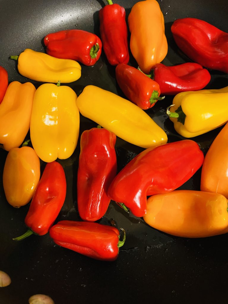 Sweet mini bell peppers in a skillet. 