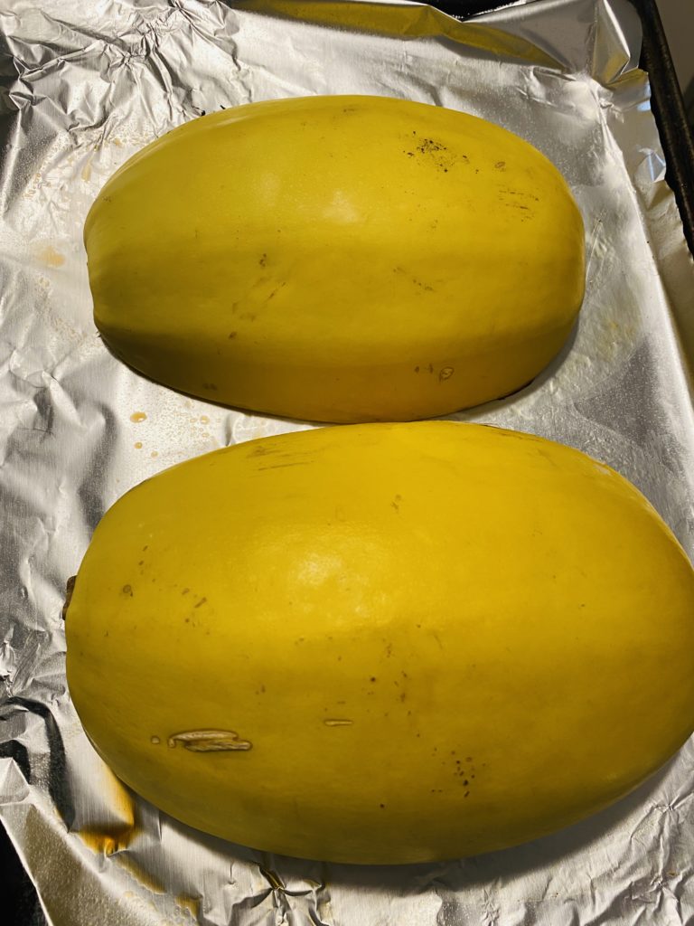 Spaghetti squash ready to be roasted.