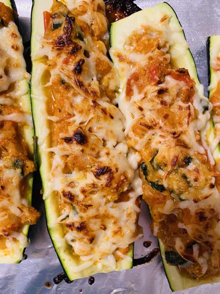 Stuffed Parmesan zucchini boats ready to be served.