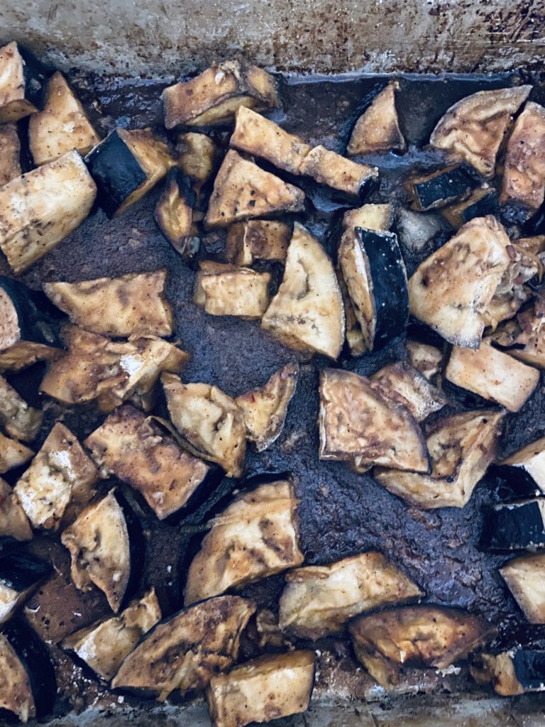 Lemon eggplant just out of the oven ready to be spooned over rice.