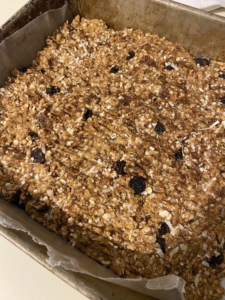 A large tray of peanut butter date granola bars.