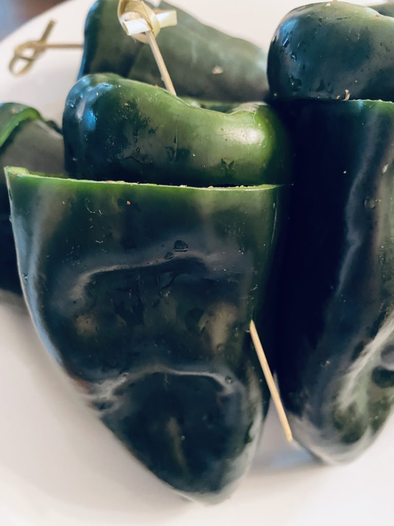 Stuffed poblano peppers ready to be roasted.