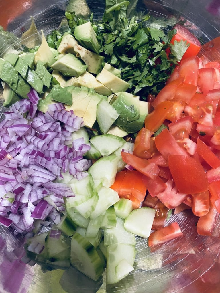 Tomato Avocado Cilantro Salad with Yogurt Lime Dressing ready to be dressed.