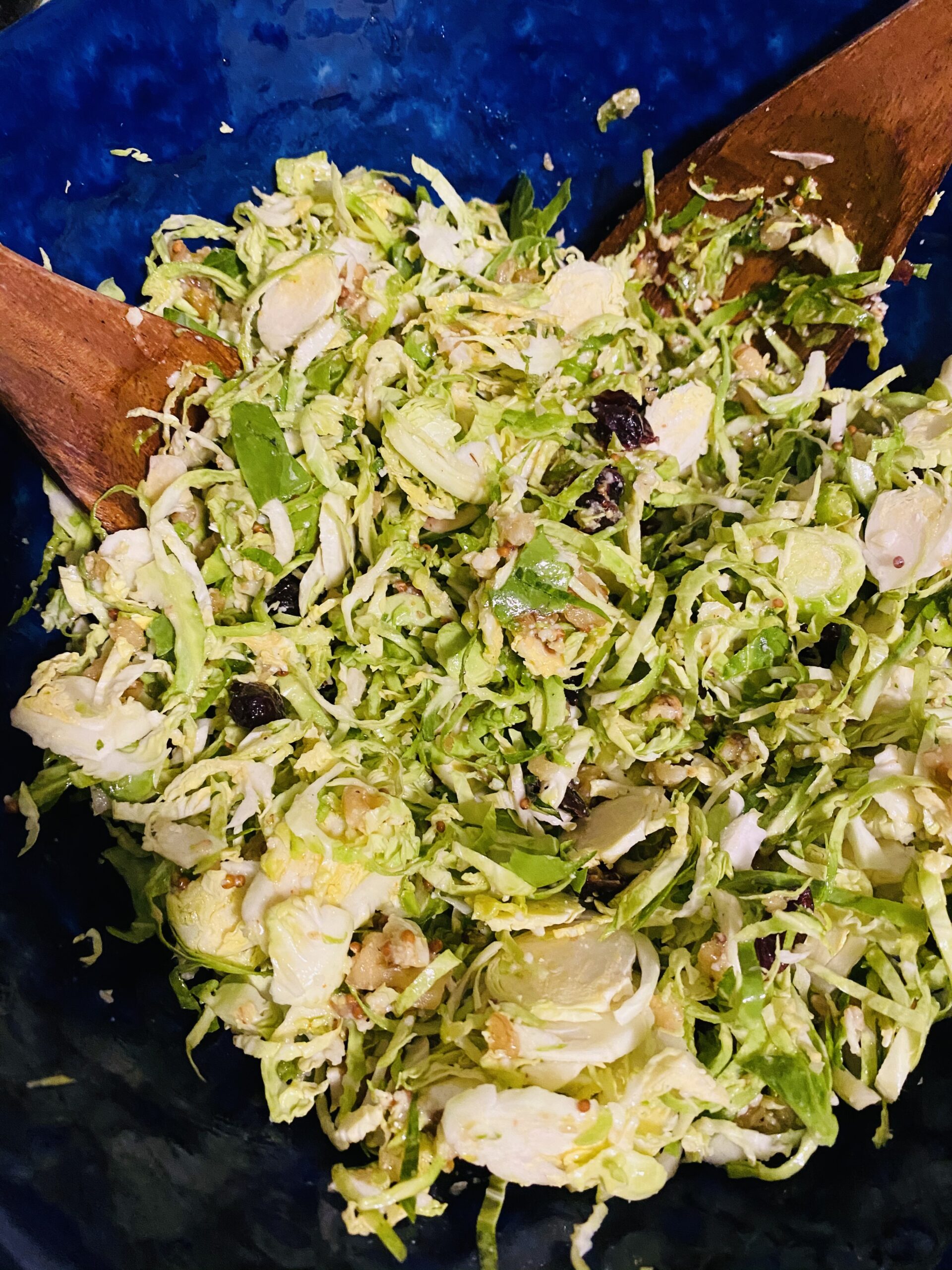 Shaved Brussel Sprout Salad with Mustard Dressing ready to be enjoyed.