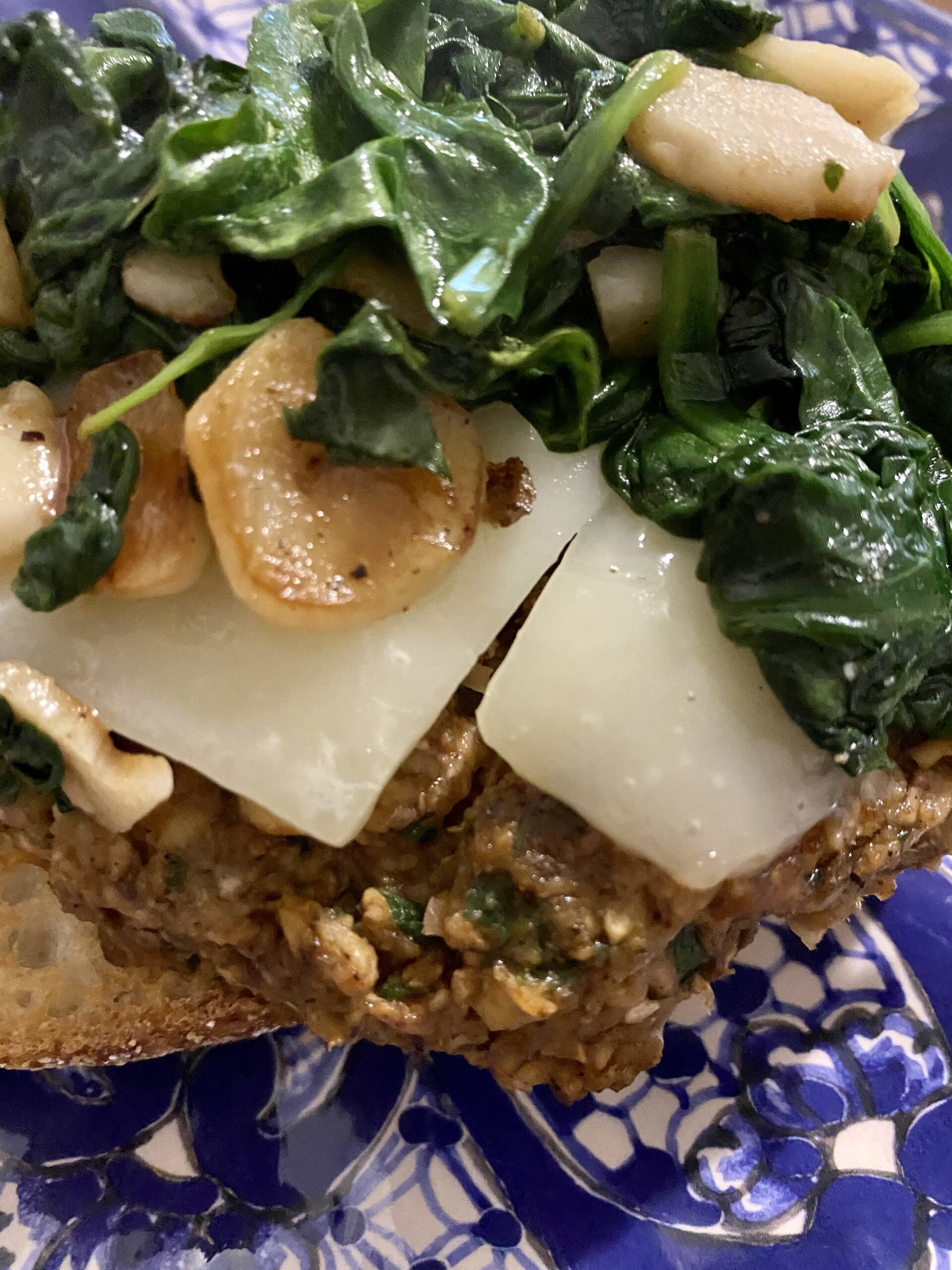 Mushroom Chickpea Burger with sautéed spinach and cheese