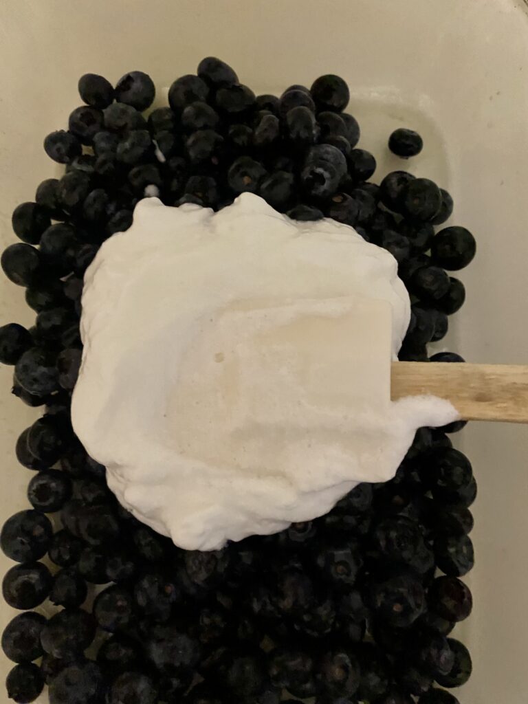 Egg whites beaten in a food processor for a Blueberry Cobbler